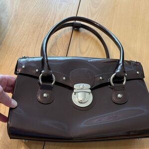 Beijo dark brown patent leather shoulder bag with magnetic close.